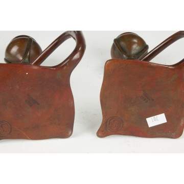 A Pair of Tiffany Bronze Candle Holders