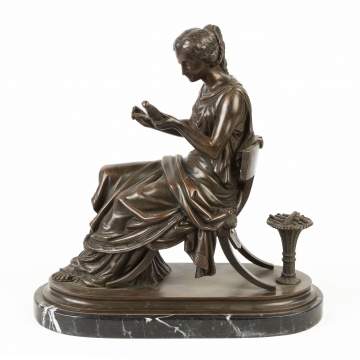 Bronze Sculpture of a Seated Lady Spinning Yarn