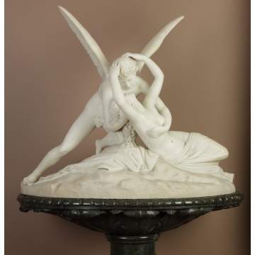 A Large Carved Marble Group of Cupid and Psyche on Green Marble Pedestal