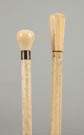 Two Fluted Canes with Carved Handles