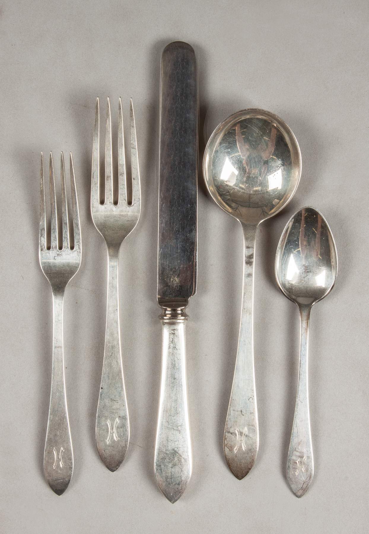Faneuil five-piece flatware set in sterling silver.