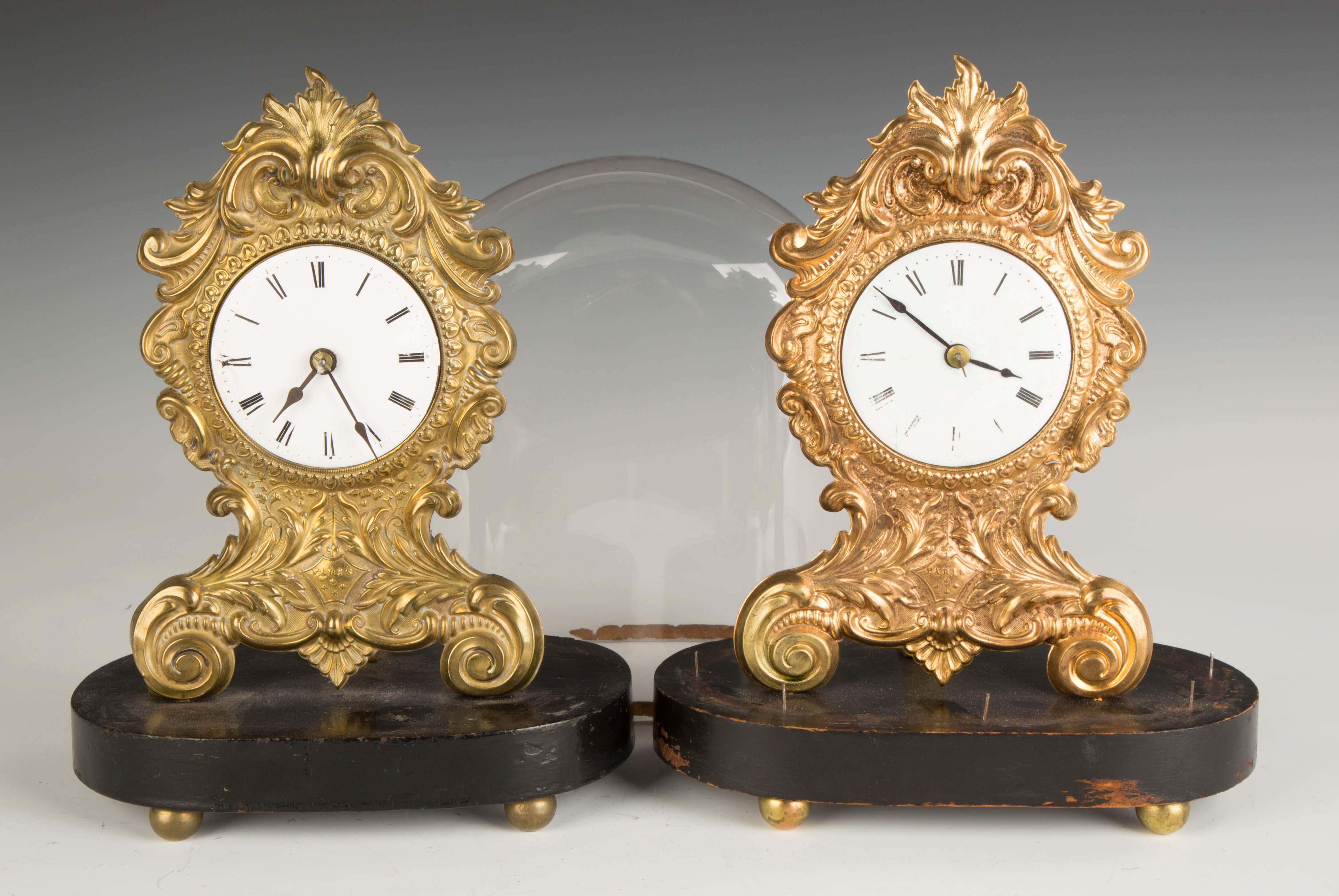 Two Stamped Brass Clocks Cottone Auctions