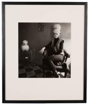 Diane Arbus (American, 1923-1971) "Lady Bartender at Home with a Souvenir Dog, New Orleans, LA., 1964"