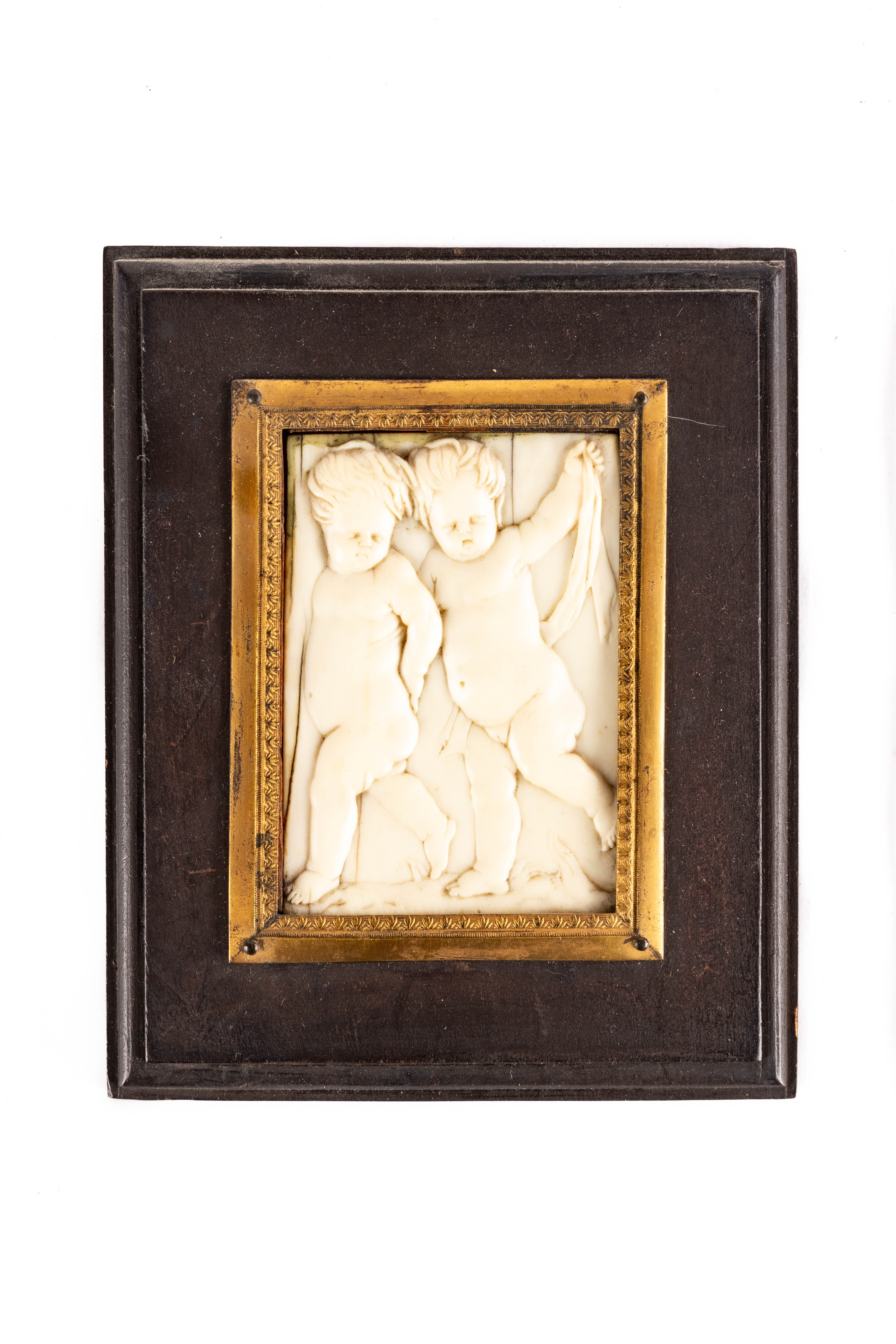 Early Carved Bone Plaque of Putti Figures