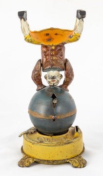 Clown on Globe Cast Iron Mechanical Bank