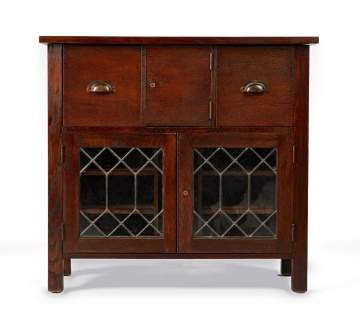 An Arts & Crafts Oak Side Cabinet with Leaded Glass Doors