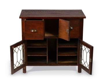 An Arts & Crafts Oak Side Cabinet with Leaded Glass Doors