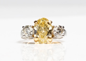 Platinum, High Karat Gold and Fancy Yellow Diamond Three-Stone Ring