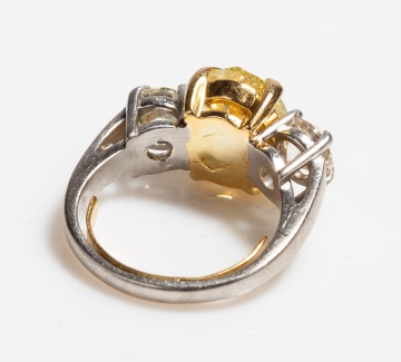 Platinum, High Karat Gold and Fancy Yellow Diamond Three-Stone Ring