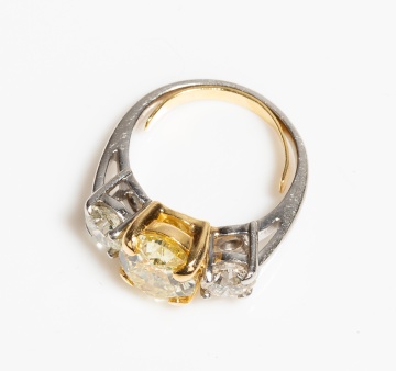 Platinum, High Karat Gold and Fancy Yellow Diamond Three-Stone Ring