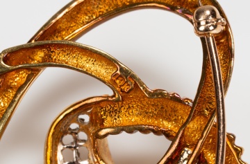 18K Gold and Diamond Knot Brooch and a Gold Serpent Pendant with Turquoise Eyes