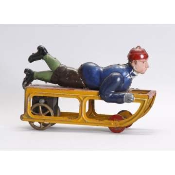 German Hand Painted Tin Boy on Sled