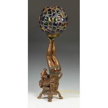 Patinated Metal Figural Young Lady Lamp holding a Leaded Glass Chunked Shade