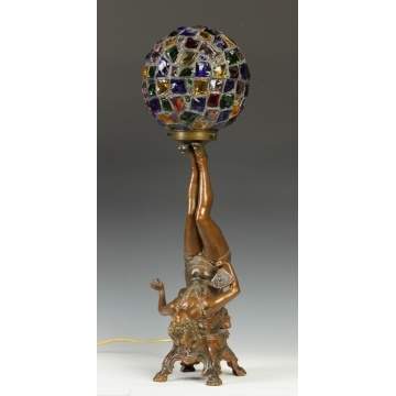 Patinated Metal Figural Young Lady Lamp holding a Leaded Glass Chunked Shade