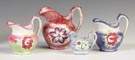 Four Spatterware Decorated Pitchers